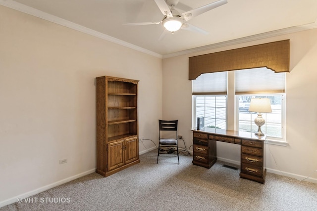 office space featuring light carpet, ceiling fan, ornamental molding, and baseboards