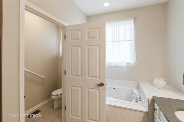 full bath featuring a garden tub, toilet, visible vents, vanity, and tile patterned floors