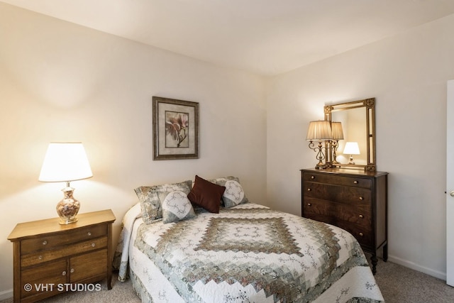 carpeted bedroom with baseboards