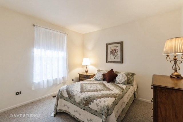 carpeted bedroom with baseboards