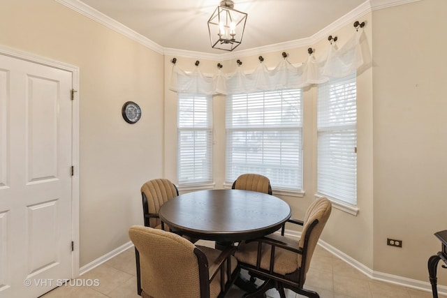 dining room featuring crown molding, plenty of natural light, and light tile patterned floors