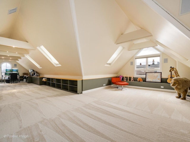 additional living space featuring carpet, visible vents, and a wealth of natural light