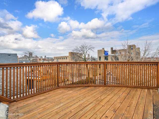 wooden terrace with a city view