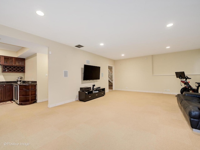 workout area with light carpet, indoor wet bar, and recessed lighting