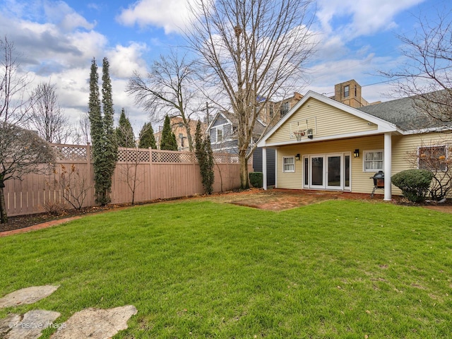 view of yard with a fenced backyard and a patio