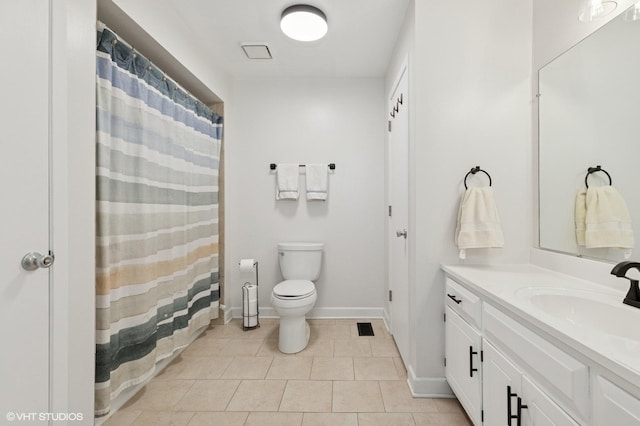 bathroom featuring visible vents, baseboards, toilet, tile patterned flooring, and vanity