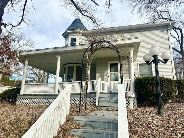 victorian house featuring a porch