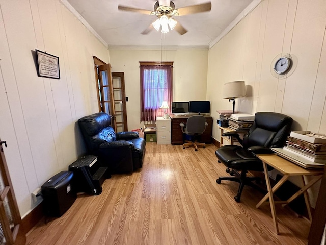 office with ornamental molding, light wood-type flooring, and a ceiling fan