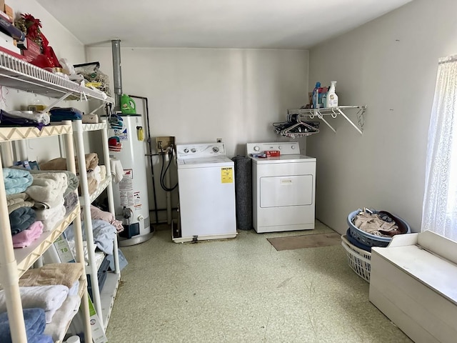 laundry room featuring laundry area, gas water heater, and independent washer and dryer