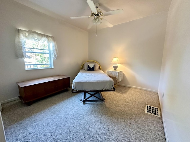 carpeted bedroom with ceiling fan, visible vents, and baseboards