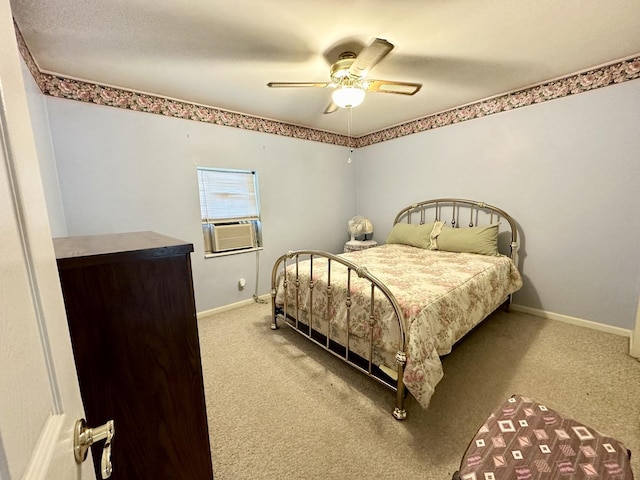 bedroom with a ceiling fan, baseboards, cooling unit, and light colored carpet