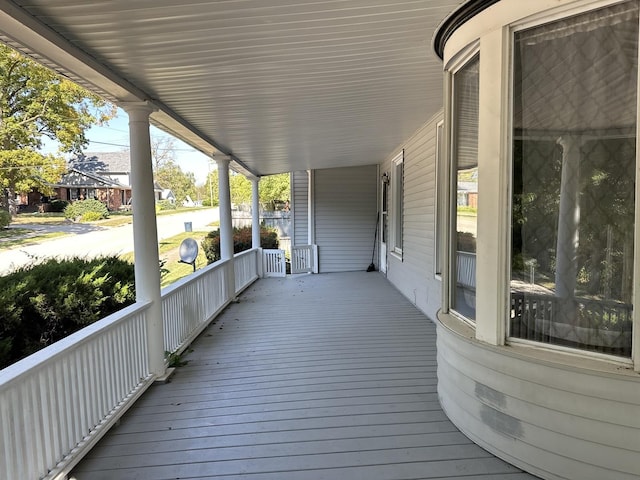 wooden terrace with a porch