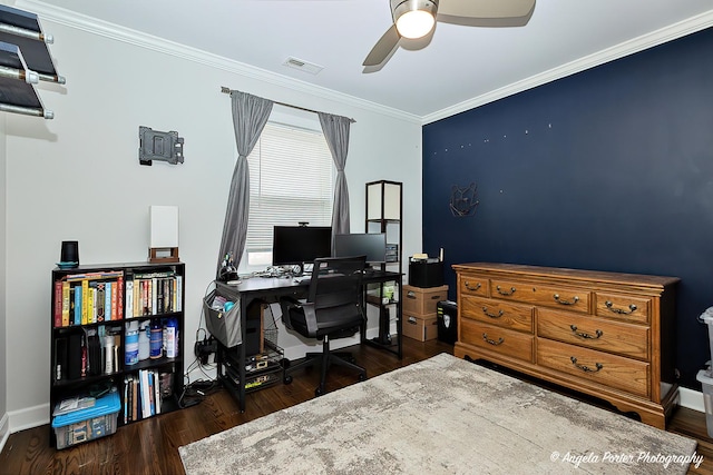 home office with a ceiling fan, wood finished floors, visible vents, and crown molding