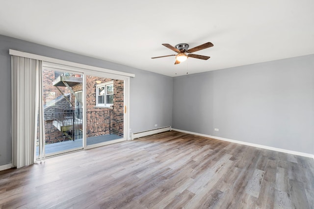 unfurnished room featuring ceiling fan, light wood-type flooring, a baseboard radiator, and baseboards