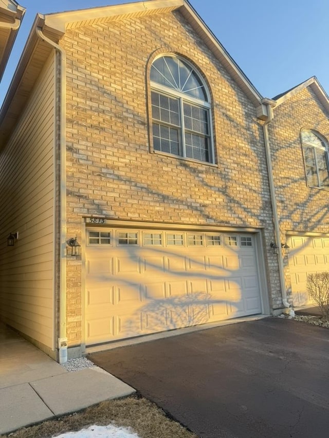 view of home's exterior with a garage