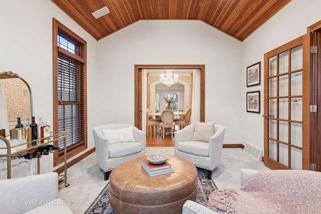 sitting room with lofted ceiling, wooden ceiling, visible vents, and a chandelier