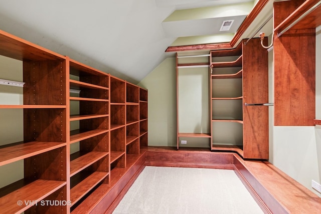 spacious closet with lofted ceiling and visible vents