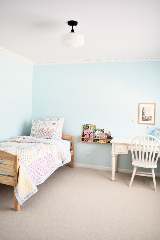 bedroom featuring carpet and baseboards