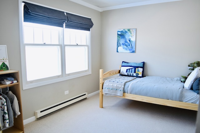 bedroom with carpet floors, baseboards, a baseboard heating unit, and ornamental molding