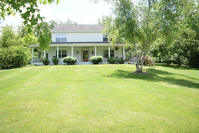 farmhouse-style home featuring a front lawn and a porch