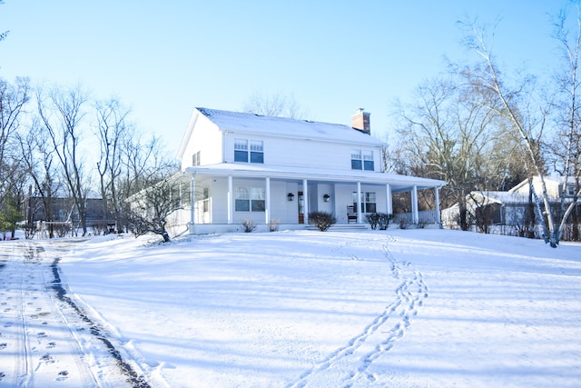 view of front of property featuring a porch and a chimney