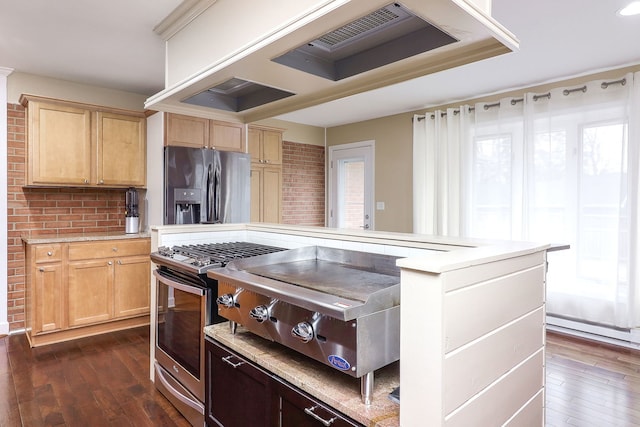 kitchen with light brown cabinets, stainless steel appliances, light countertops, and premium range hood