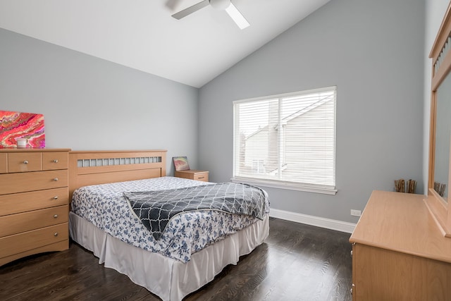 bedroom featuring vaulted ceiling, dark wood-style flooring, a ceiling fan, and baseboards