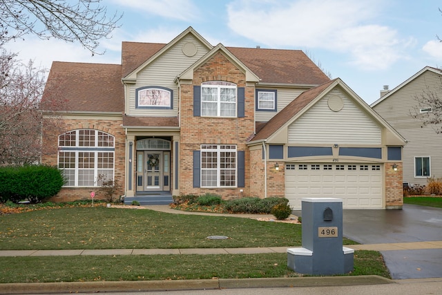 traditional home with a garage, brick siding, and driveway