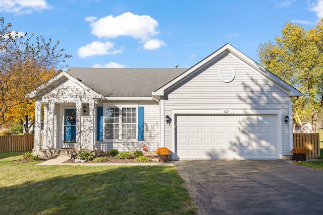 single story home with a garage, driveway, fence, and a front lawn