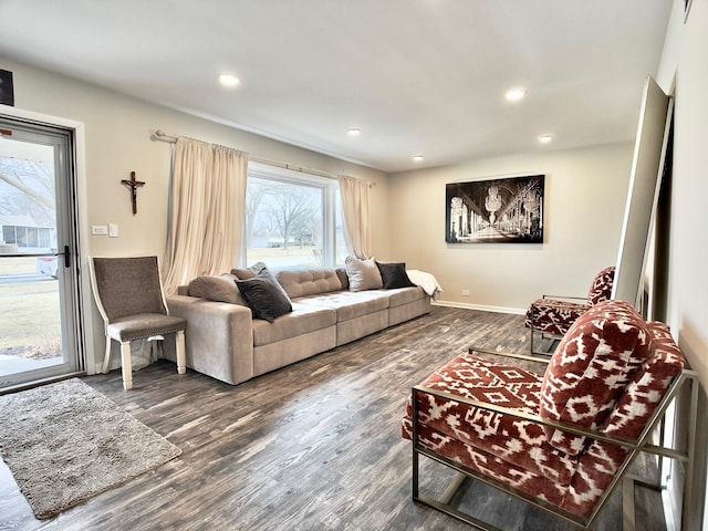 living area with recessed lighting, baseboards, and wood finished floors