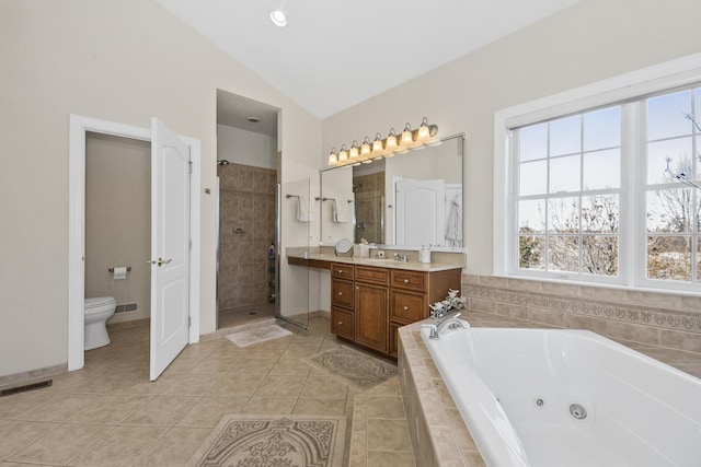 full bathroom with lofted ceiling, tile patterned flooring, visible vents, vanity, and a whirlpool tub