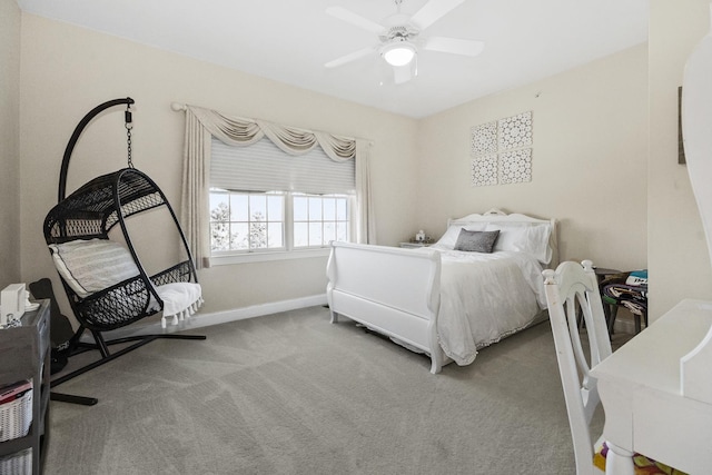 bedroom with baseboards, a ceiling fan, and light colored carpet