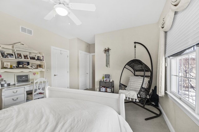 bedroom featuring ceiling fan, carpet floors, visible vents, and baseboards