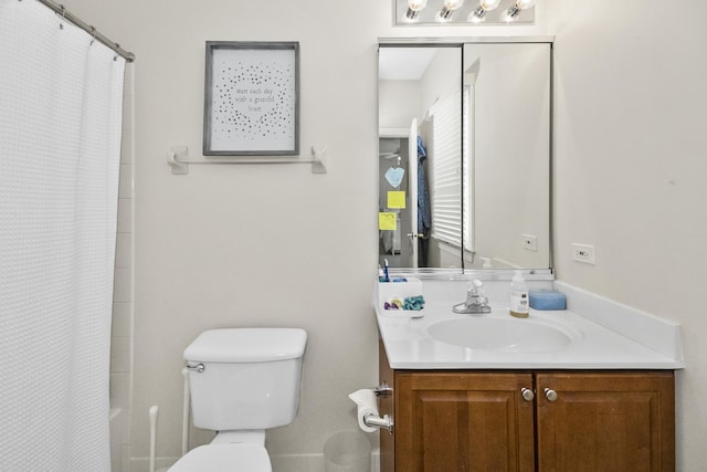 full bathroom with shower / tub combo, vanity, and toilet