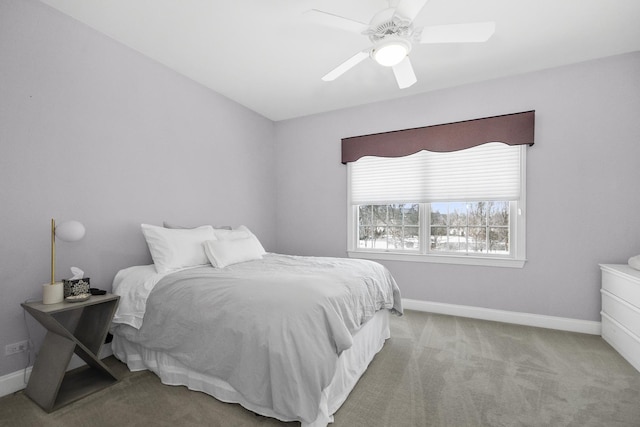 bedroom with baseboards, a ceiling fan, and light colored carpet