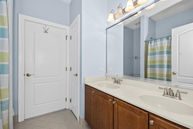 bathroom featuring tile patterned flooring, a sink, curtained shower, and double vanity