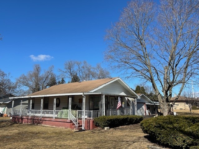 view of side of home featuring a porch