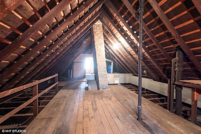 attic featuring an upstairs landing