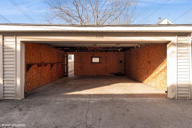 view of vehicle parking featuring a detached garage