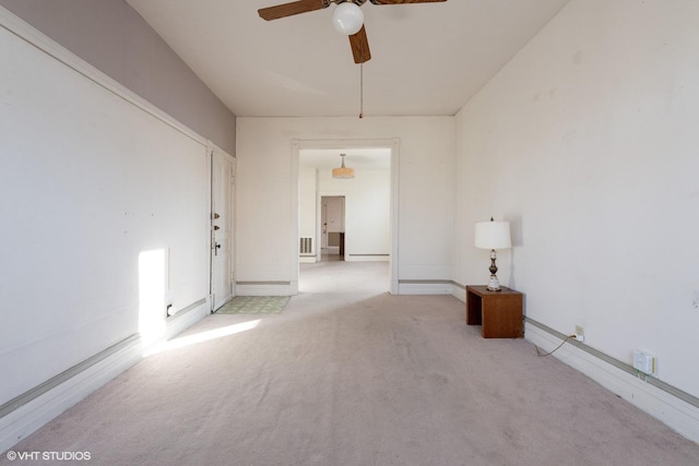 unfurnished room featuring light colored carpet and ceiling fan