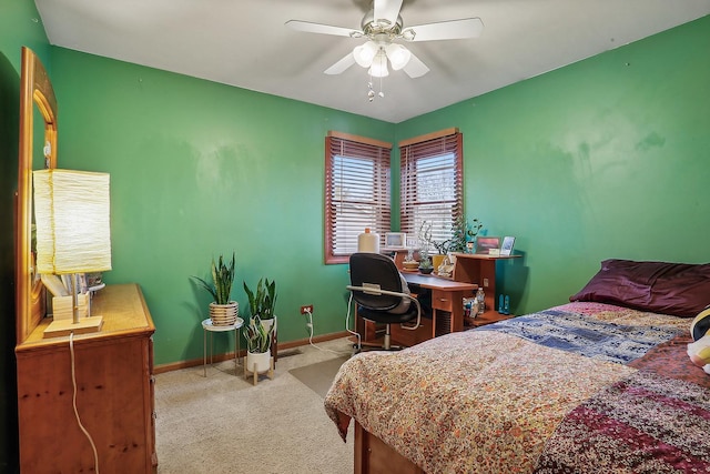 bedroom with a ceiling fan, carpet, and baseboards