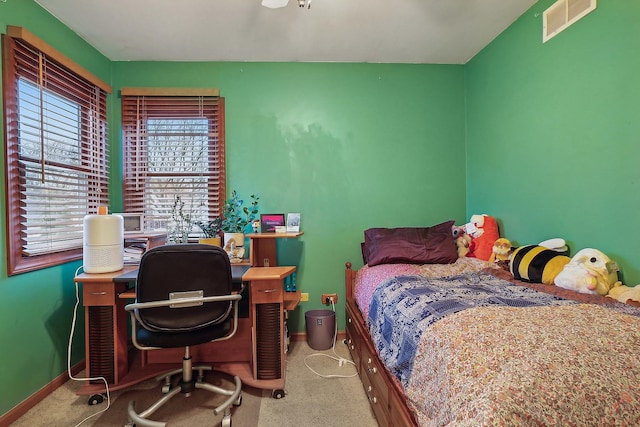 bedroom with carpet, visible vents, and baseboards