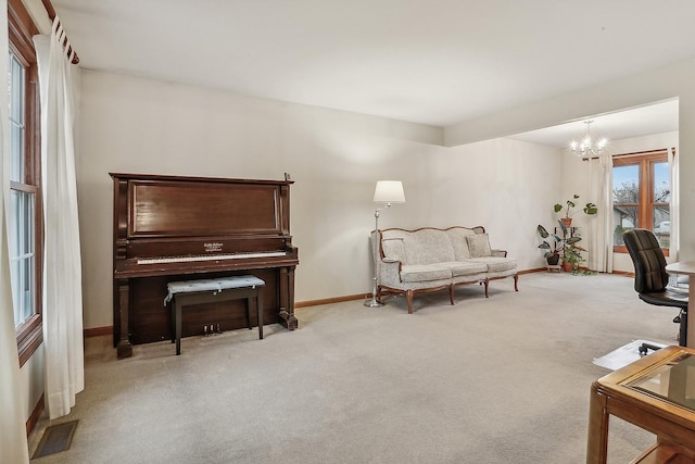 sitting room featuring baseboards, a notable chandelier, visible vents, and light colored carpet