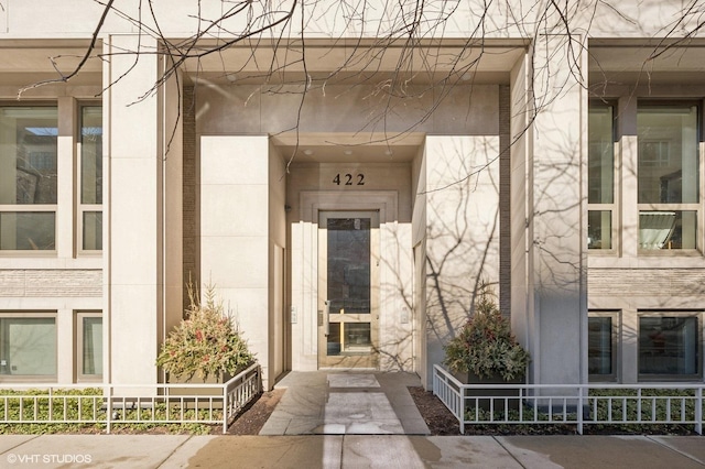 view of exterior entry featuring a porch