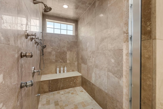 bathroom with a tile shower