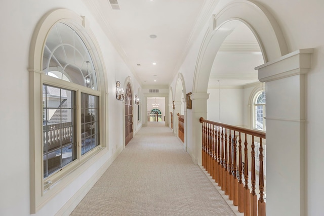 hall featuring ornamental molding, visible vents, and recessed lighting