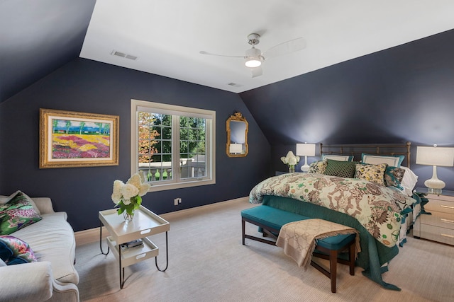 carpeted bedroom featuring a ceiling fan, visible vents, vaulted ceiling, and baseboards