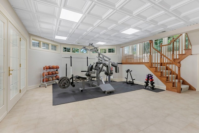 workout area featuring an ornate ceiling, visible vents, and baseboards