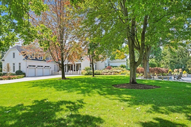 exterior space with a garage, a front yard, and driveway