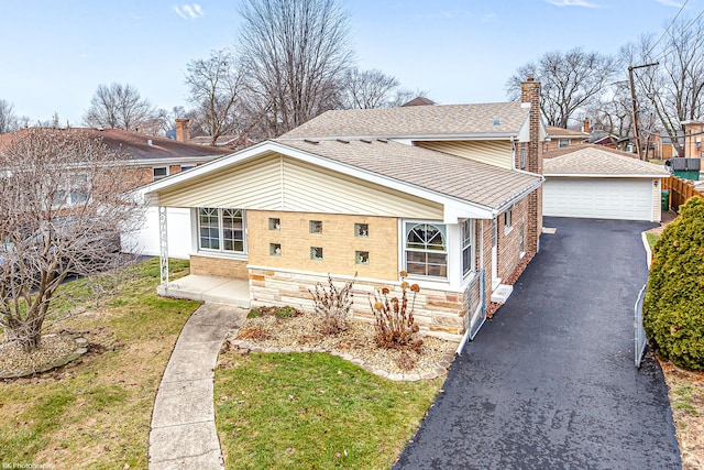 view of front of house with a garage, brick siding, a front lawn, and roof with shingles